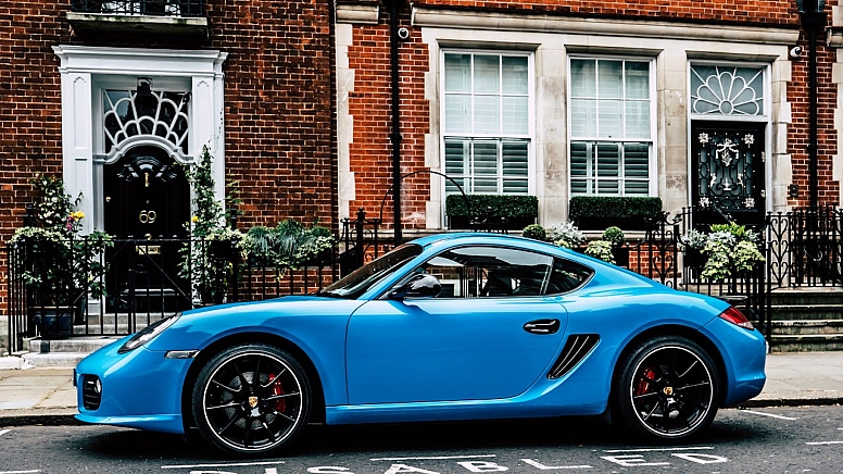 blue coupe on road