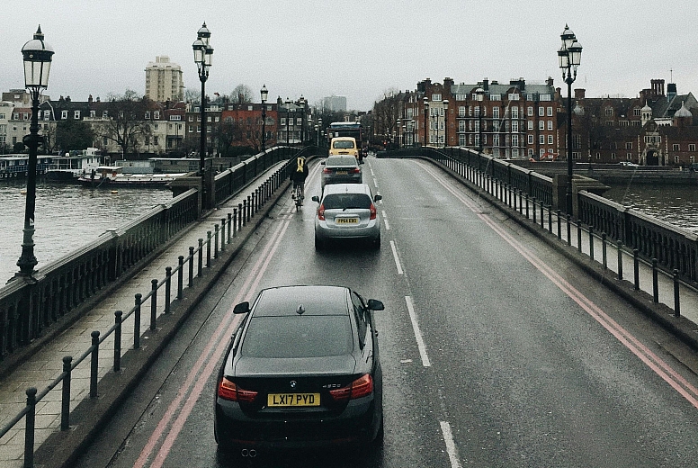 driving on london bridge under gray sky